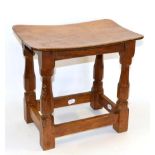 A Robert ''Mouseman'' Thompson Oak Dish Top Stool, on four octagonal legs joined by stretchers, with