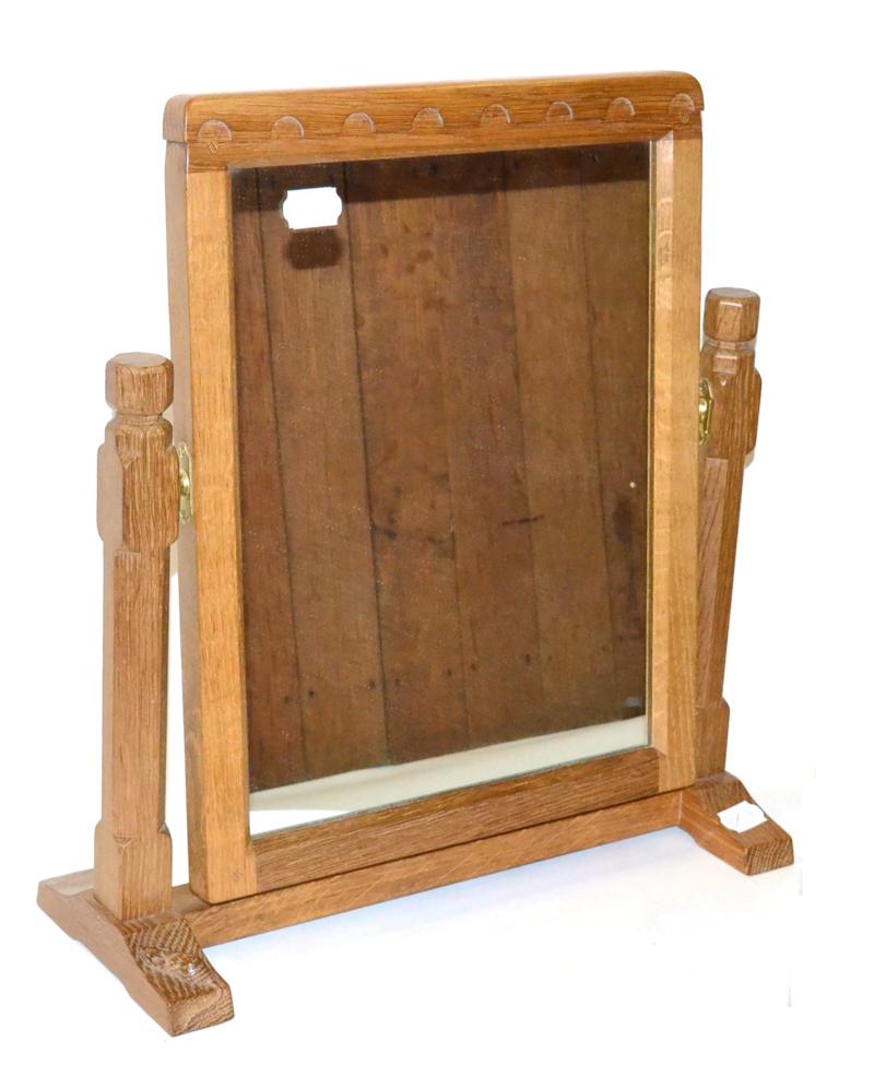 A Robert ''Mouseman'' Thompson Oak Stand Mirror, the rectangular mirror pivots between two octagonal