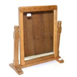 A Robert ''Mouseman'' Thompson Oak Stand Mirror, the rectangular mirror pivots between two octagonal