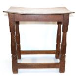 A Robert ''Mouseman'' Thompson Oak Dish Top Stool, on four octagonal legs joined by stretchers, with