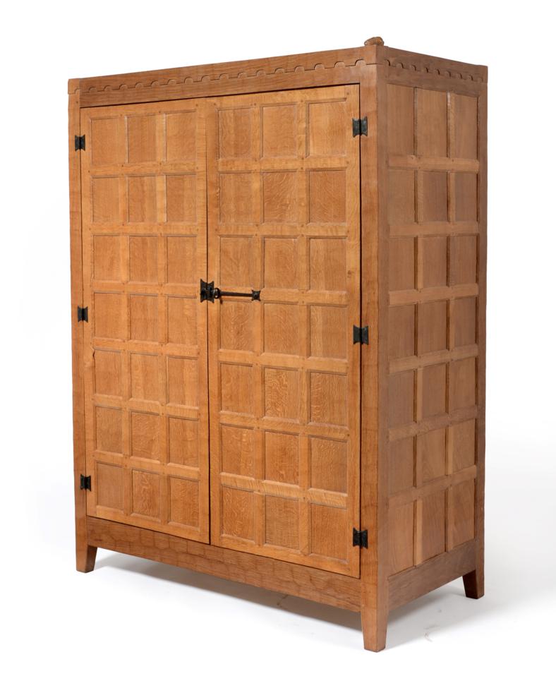 A Peter ''Rabbitman'' Heap Panelled Oak Wardrobe, with two doors, opening to reveal a rail and