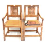 Two Robert ''Mouseman'' Thompson Oak Lattice Back Armchairs, on two octagonal front legs, each