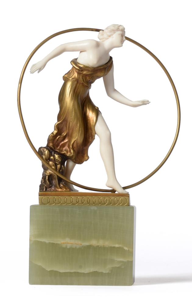 Georges Morin (German, 1874-1950): A Gilt Bronze and Ivory Figure, circa 1920, modelled as a semi-