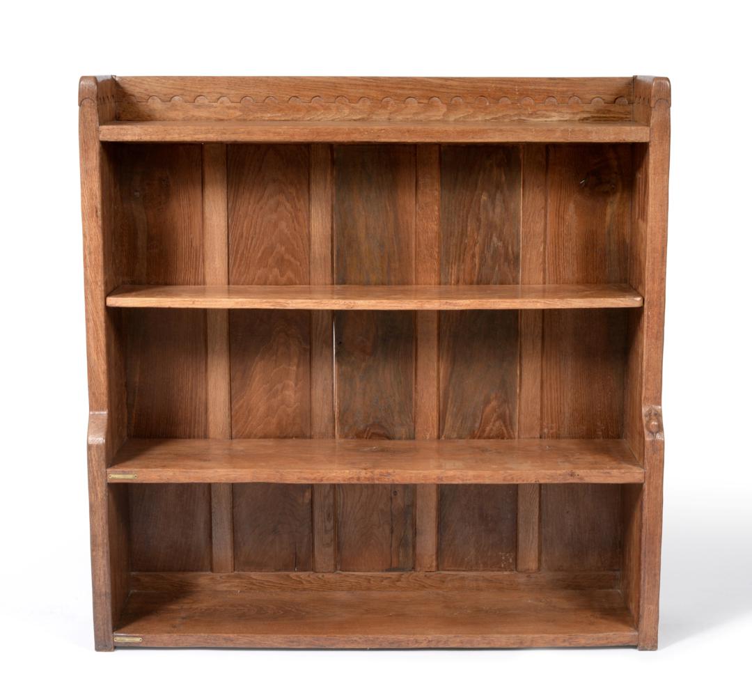 A Robert ''Mouseman'' Thompson Oak 4ft Open Bookcase, solid ends and panelled back, raised