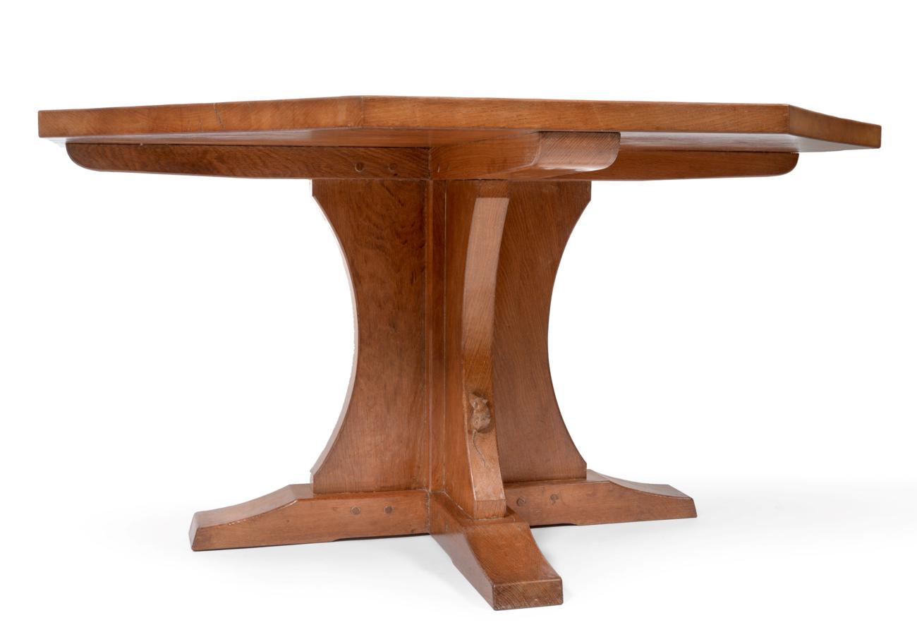 A Robert ''Mouseman'' Thompson Oak 4ft 6'' Octagonal Dining Table, on a cruciform base, with