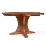 A Robert ''Mouseman'' Thompson Oak 4ft 6'' Octagonal Dining Table, on a cruciform base, with