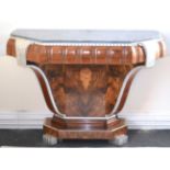 An Art Deco Walnut and Silvered Console Table, with a grey marble top, above a silvered frieze,