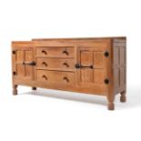 A Robert ''Mouseman'' Thompson Panelled Oak 5ft Sideboard, with raised upstand, above three