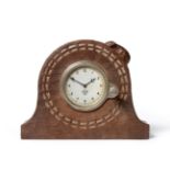 A Robert ''Mouseman'' Thompson Oak Mantel Clock, the circular case with chip carving, set with a