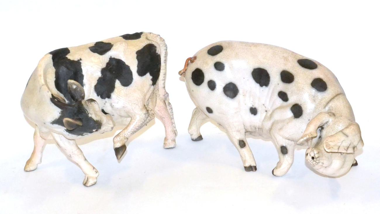 Lawson E Rudge: A Raku Pottery Gloucestershire Old Spot Pig, signed, 40cm long; and A Holstein