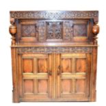 An Early 18th Century Joined Oak Press Cupboard, the carved frieze above lozenge carved fielded