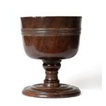 A Charles II Turned Lignum Vitae Wassail Bowl, circa 1680, with central reeded moulding on a knopped