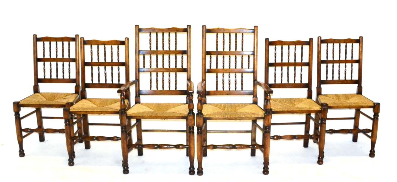 A Set of Six Rush-Seated Spindle Back Dining Chairs, 20th century, comprising four singles with