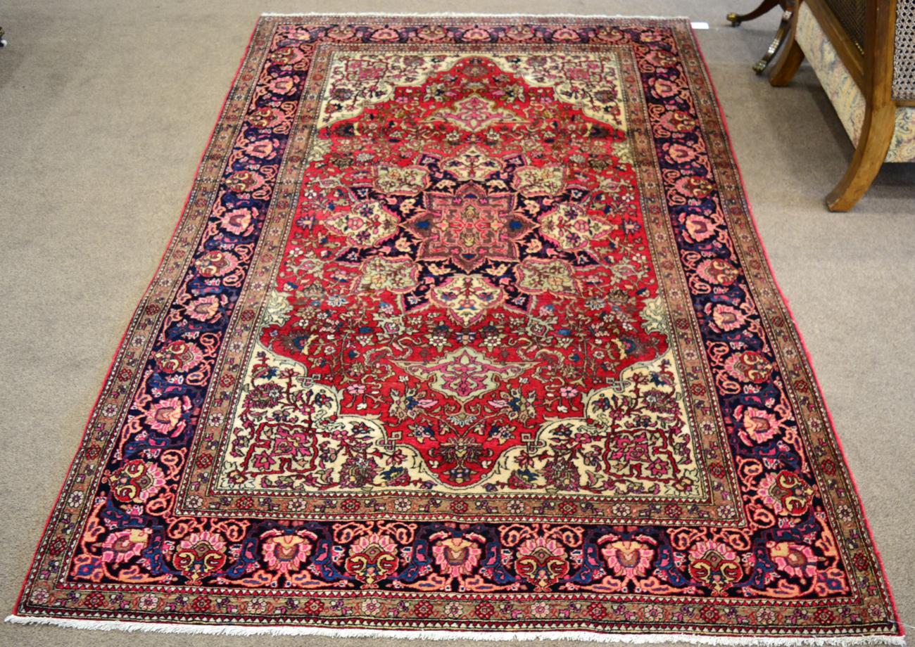 Isfahan Rug Central Iran The raspberry field centred by a flowerhead medallion framed by cusped