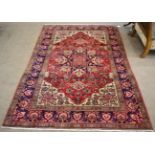 Isfahan Rug Central Iran The raspberry field centred by a flowerhead medallion framed by cusped