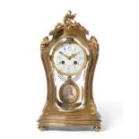 An Art Nouveau Brass Four Glass Striking Mantel Clock, circa 1900, applied floral mounts, bevelled