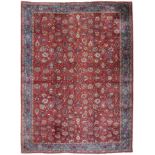 Indo-Tabriz Carpet The aubergine field with an allover design of palmettes and flowerheads