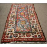 Kazak Rug Central Caucasus The madder field with three medallions enclosed by wide ivory Harshang