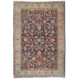 Ghom Carpet Central Iran The indigo field with an allover design of large flowerheads and