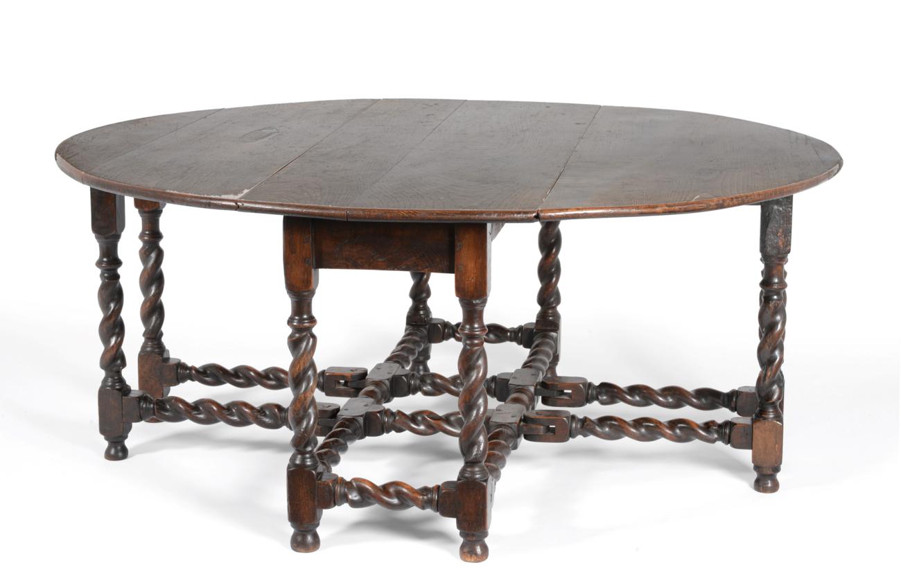 An Oak Six-to-Eight Seater Dropleaf Dining Table, circa 1700, with double gatelegs to form an