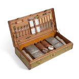 A Vintage Brown Leather and Green Canvas Car Picnic Set, with brass carrying handles, the hinged lid