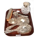 Silver and cut glass scent bottle, four piece silver filled dressing table set, silver heart dish