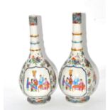 A pair of 19th century Cantonese Chinese bottles of pear shape painted in famille rose enamels