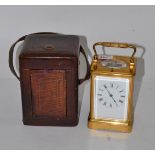 A brass striking and repeating carriage clock, with fitted case