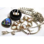 A 9ct gold opal and diamond ring, a cameo bracelet, stamped '9ct', silver bracelet and a butterfly
