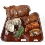A group of carved wooden, soapstone and pottery rhinoceros and hippopotamus models