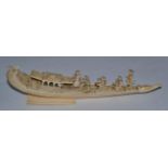 An Indian carved ivory model of a boat with eight figures, late 19th century