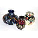 A group of modern Moorcroft including a 'Cavillon Blue' pattern vase, 'Meadow Charm' pattern