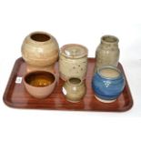 Six items of Coxwold pottery comprising jar and cover, four various vases and a bowl