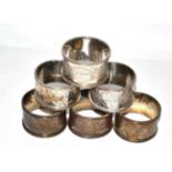 A set of six silver numbered napkin rings