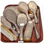 A quantity of silver backed dressing table brushes, mirrors etc