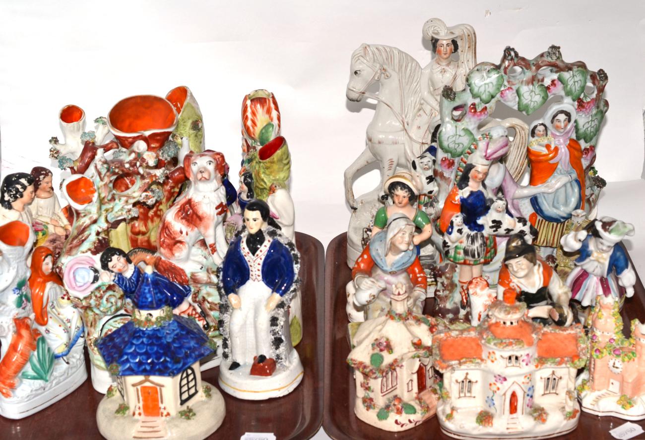 Two trays containing a quantity of 19th century Staffordshire, pastille burners, flat back figures