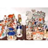 Two trays containing a quantity of 19th century Staffordshire, pastille burners, flat back figures