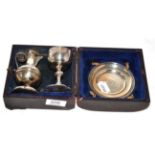 A Victorian three-piece silver travelling communion set, by Walker and Hall, Sheffield, 1890, cased