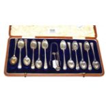 A set of twelve Edwardian silver coffee spoons and tongs, Sheffield, 1907, cased