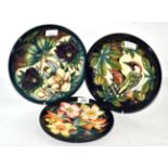 Two modern Moorcroft plates, 'Ingleswood' and 'Hellebore' pattern, 26cm diameter, together with a