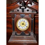 An oak mantel clock, retailed by Fattorini & Sons, Bradford