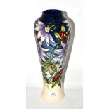 A modern Moorcroft vase, 'Star of Mikan' pattern, 36cm high (boxed) In very good condition, as new.