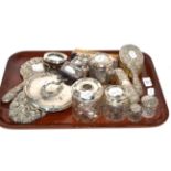 An assortment of silver dressing table brushes, mirrors, photo frames and other items, various dates