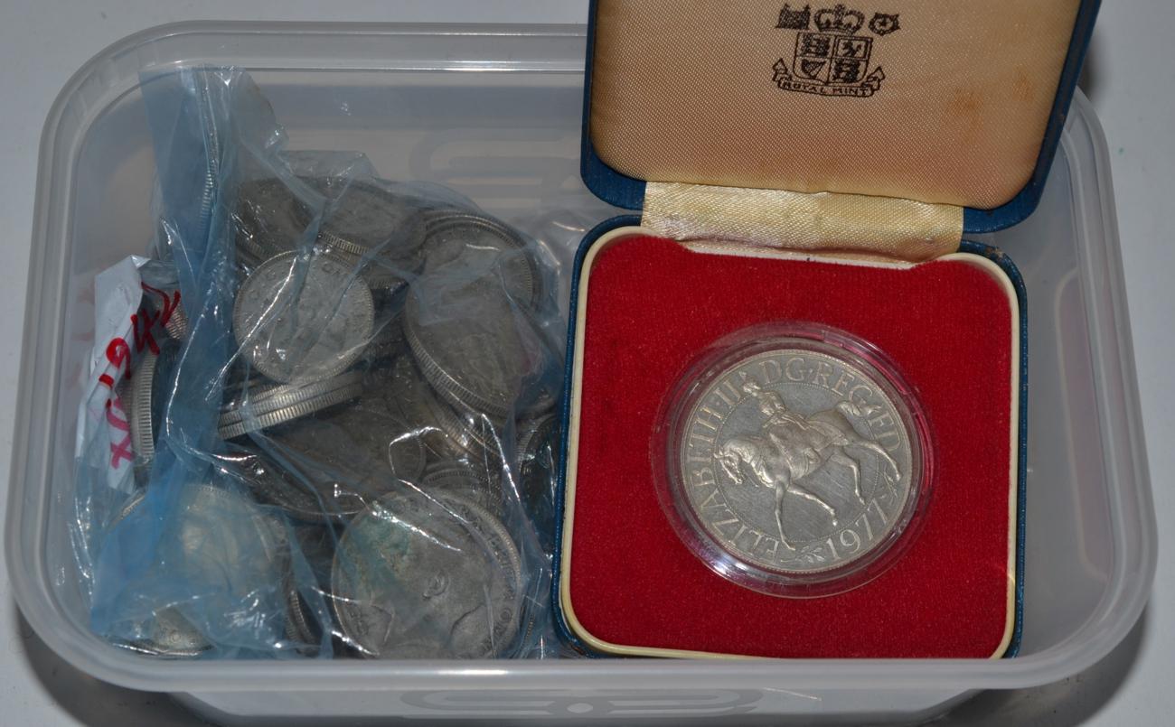 A small quantity of pre-1947 silver coins and silver note clip