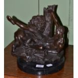 A bronze of a classical figure fighting a lion