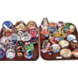 A collection of paperweights (on two trays)