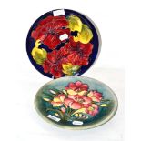 Moorcroft Hibiscus pattern plate and another Moorcroft plate
