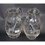 A near pair of engraved Rowland Ward giraffe glass jugs (2)