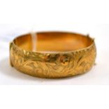 A 9ct gold bangle 24.73g gross.