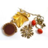 A 9ct gold citrine set leaf brooch, a seed pearl set pendant, a pair of coral screw back earrings